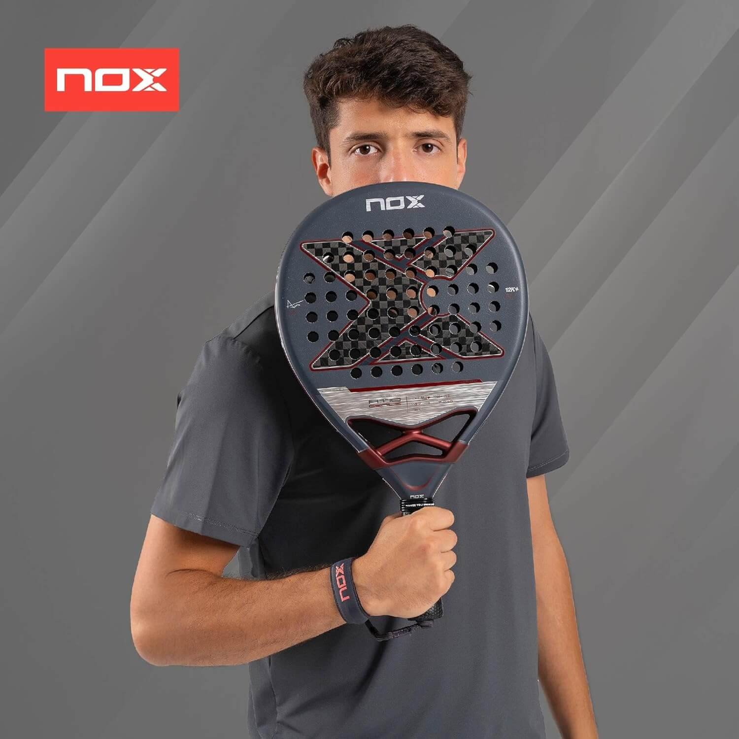 Player Holding a Nox AT10 Genius 12K 2025 Padel Racket