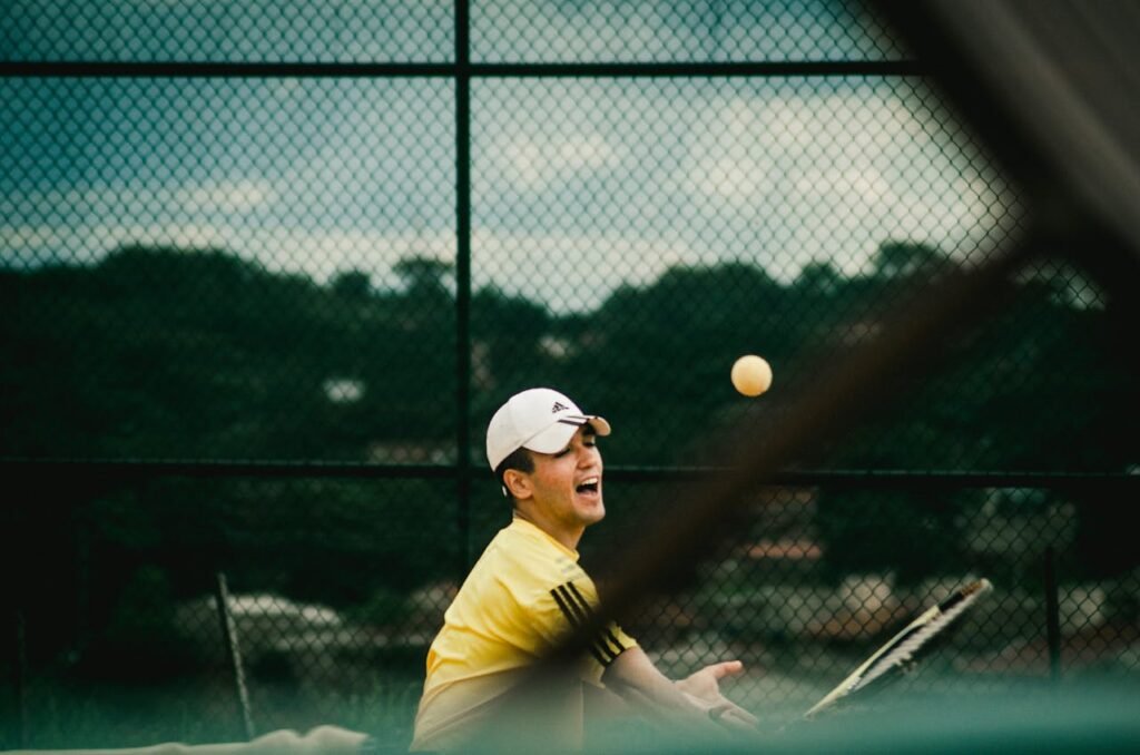 A player attempting to use a tennis racket in a padel match, demonstrating poor maneuverability