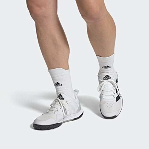 Player wearing Adidas Adizero Ubersonic 4 mens padel shoes on court ready position